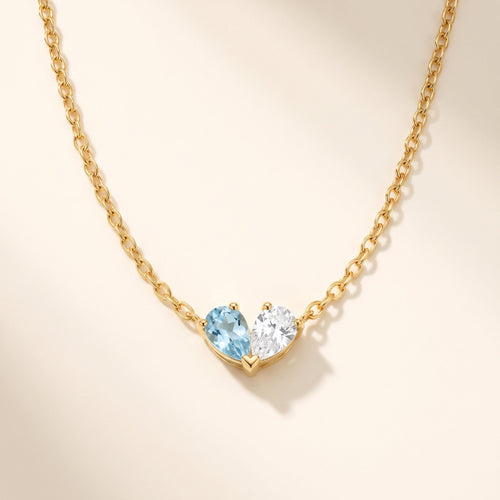Duo Birthstone Necklace with aquamarine and clear crystal forming a heart